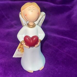Gilde Angel Figurines and Ornaments. Item no: 28046. Girl standing holding heart
